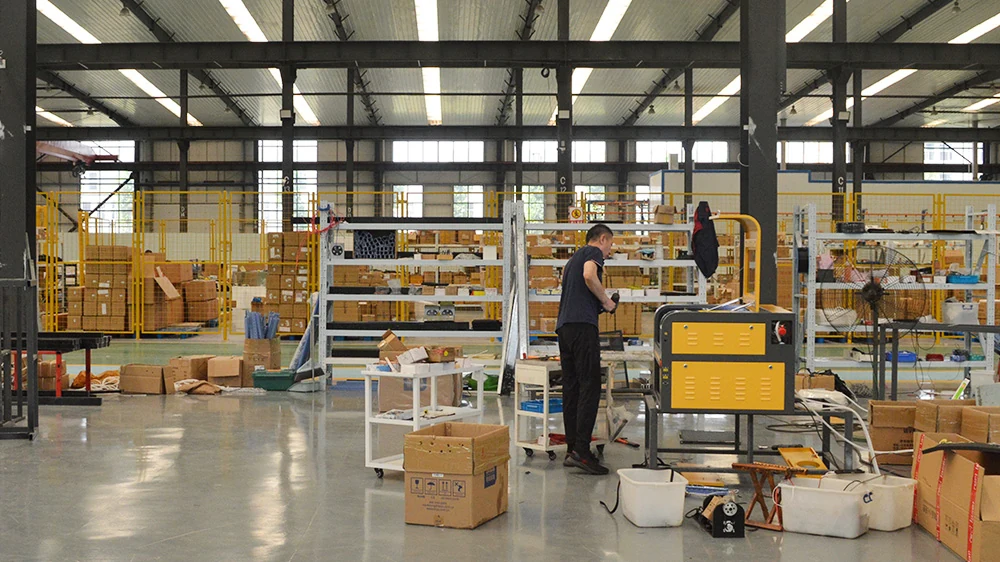 Technician testing laser equipment in a factory workshop